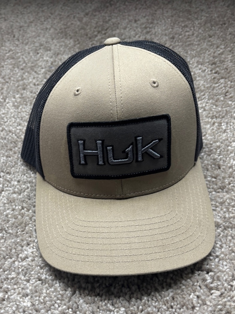 Huk Tan Front Black Mesh Patch Logo Trucker Hat